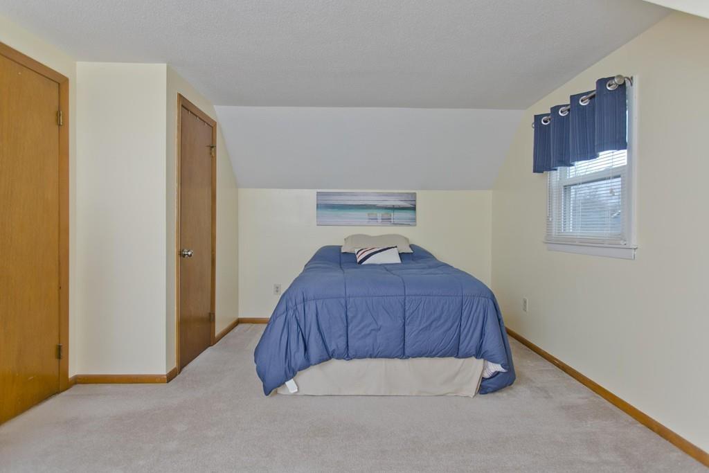 380 Tinkham Road Springfield, MA 01129 - Photo 30 of 42 a bedroom with a bed and a window
