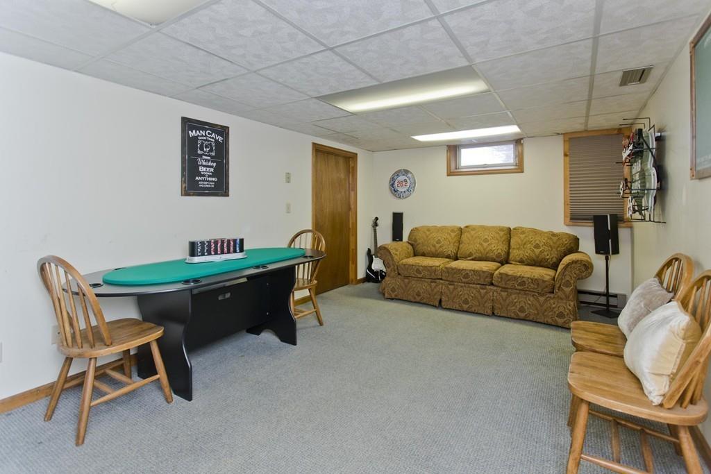 380 Tinkham Road Springfield, MA 01129 - Photo 33 of 42 a living room with furniture and a flat screen tv