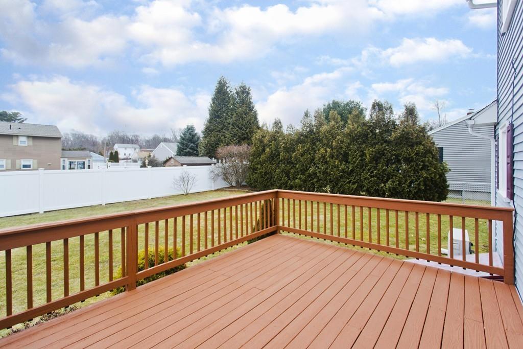 380 Tinkham Road Springfield, MA 01129 - Photo 37 of 42 a balcony with wooden floor and fence