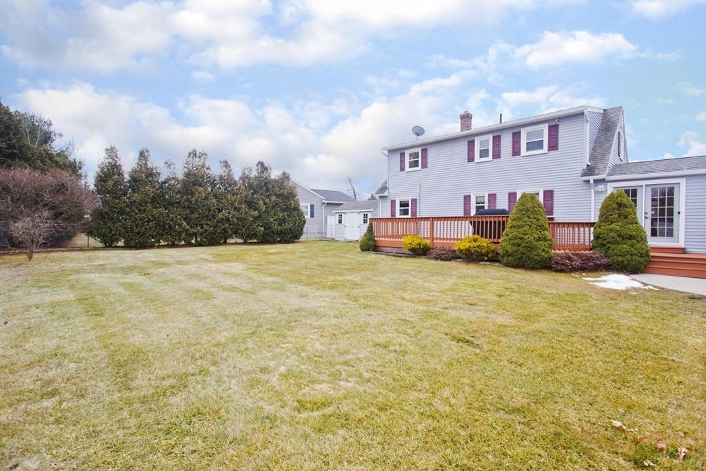 380 Tinkham Road Springfield, MA 01129 - Photo 40 of 42 a view of a white house with a big yard and large trees