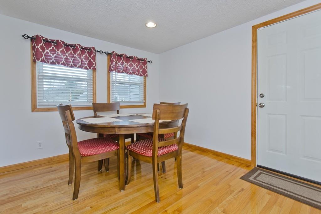 380 Tinkham Road Springfield, MA 01129 - Photo 7 of 42 a view of a dining room with furniture and wooden floor