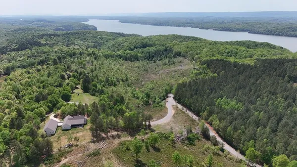 a aerial view of a house with a yard