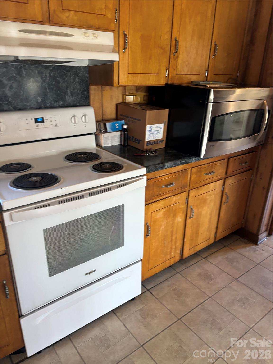 7 Post Oak Place Salisbury, NC 28147 - Photo 8 of 17 a kitchen with a stove and a microwave
