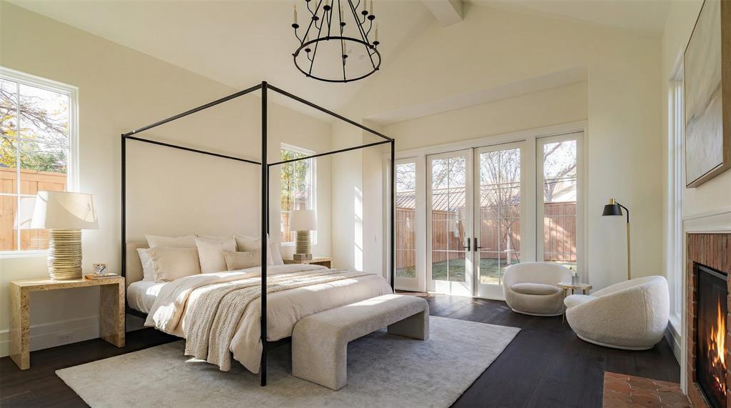 4509 Pomona Road Dallas, TX 75209 - Photo 12 of 17 a bedroom with a bed and large glass window