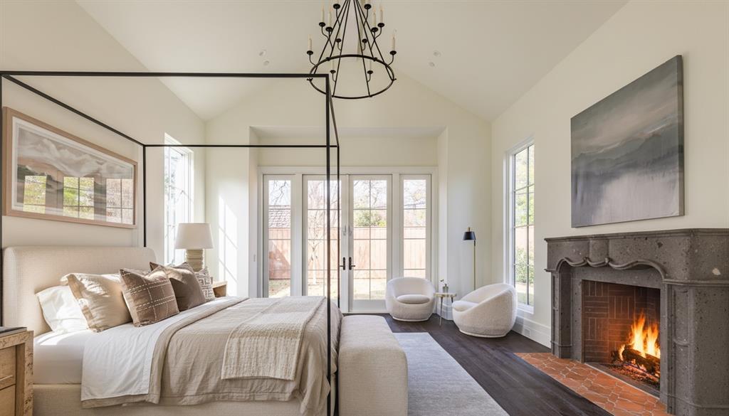 4509 Pomona Road Dallas, TX 75209 - Photo 13 of 17 a spacious bedroom with a bed and a fireplace