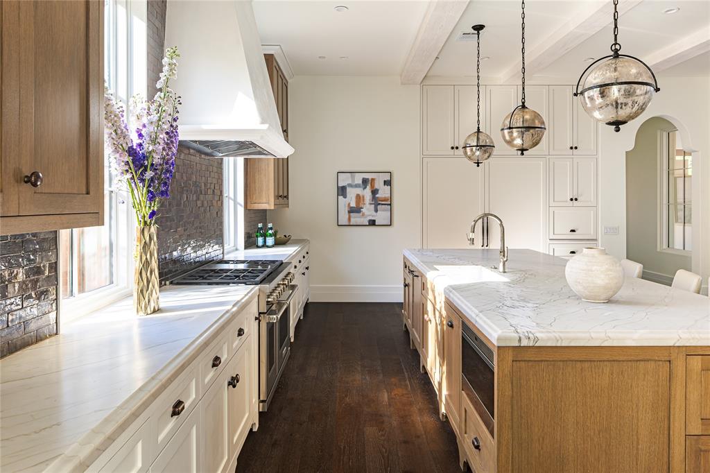 4509 Pomona Road Dallas, TX 75209 - Photo 5 of 17 a kitchen with sink stove and refrigerator