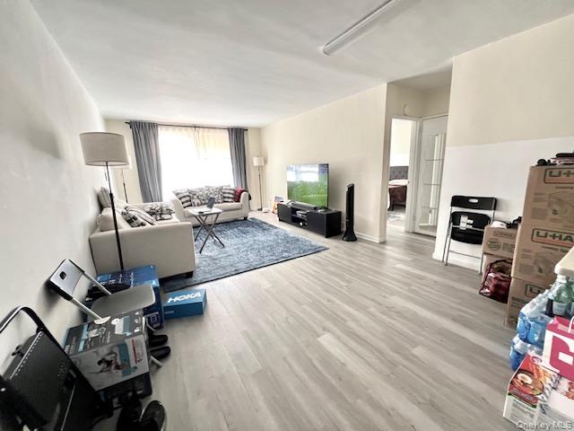 South Facing -Living area featuring wood finished floors