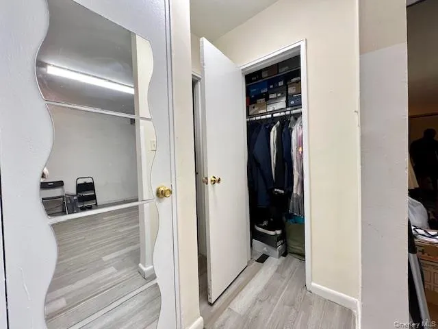a bedroom with a bed and a mirror