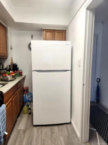 a bathroom with a toilet sink and shower curtain