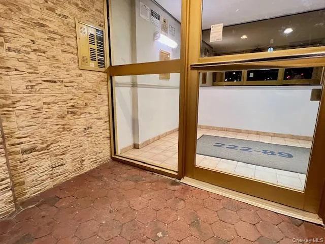 a street sign on a street next to a yard