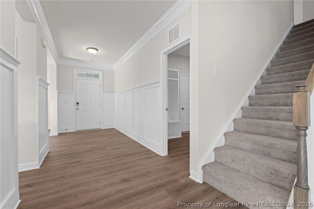 302 Elijah Way Vass, NC 28394 - Photo 11 of 44 a view of an entryway with wooden floor