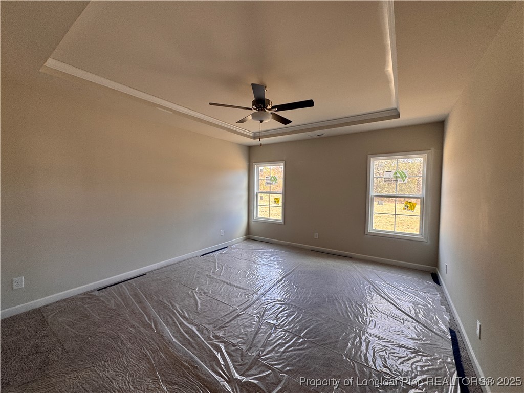 302 Elijah Way Vass, NC 28394 - Photo 13 of 28 a view of a livingroom with a ceiling fan and window