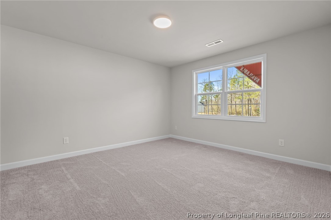 302 Elijah Way Vass, NC 28394 - Photo 13 of 44 an empty room with windows