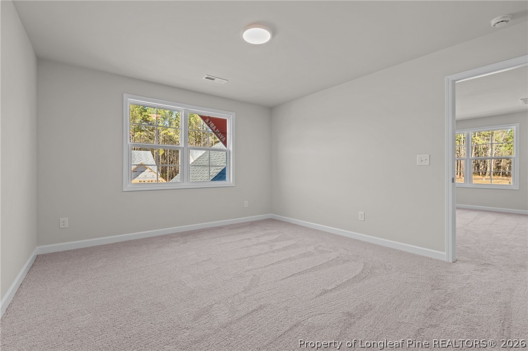 302 Elijah Way Vass, NC 28394 - Photo 14 of 44 an empty room with windows and closet