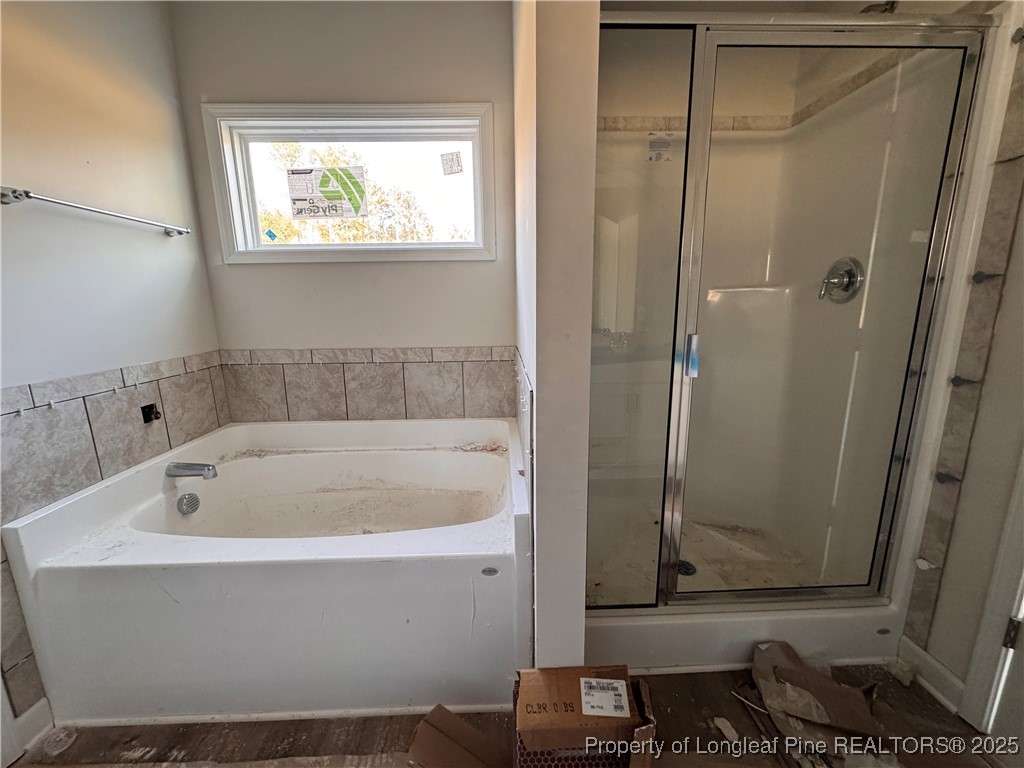 302 Elijah Way Vass, NC 28394 - Photo 15 of 28 a white bath tub sitting next to a window