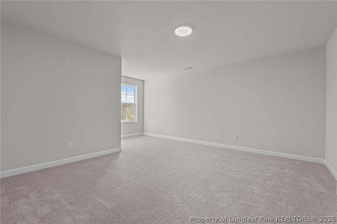 302 Elijah Way Vass, NC 28394 - Photo 16 of 44 a view of an empty room with window