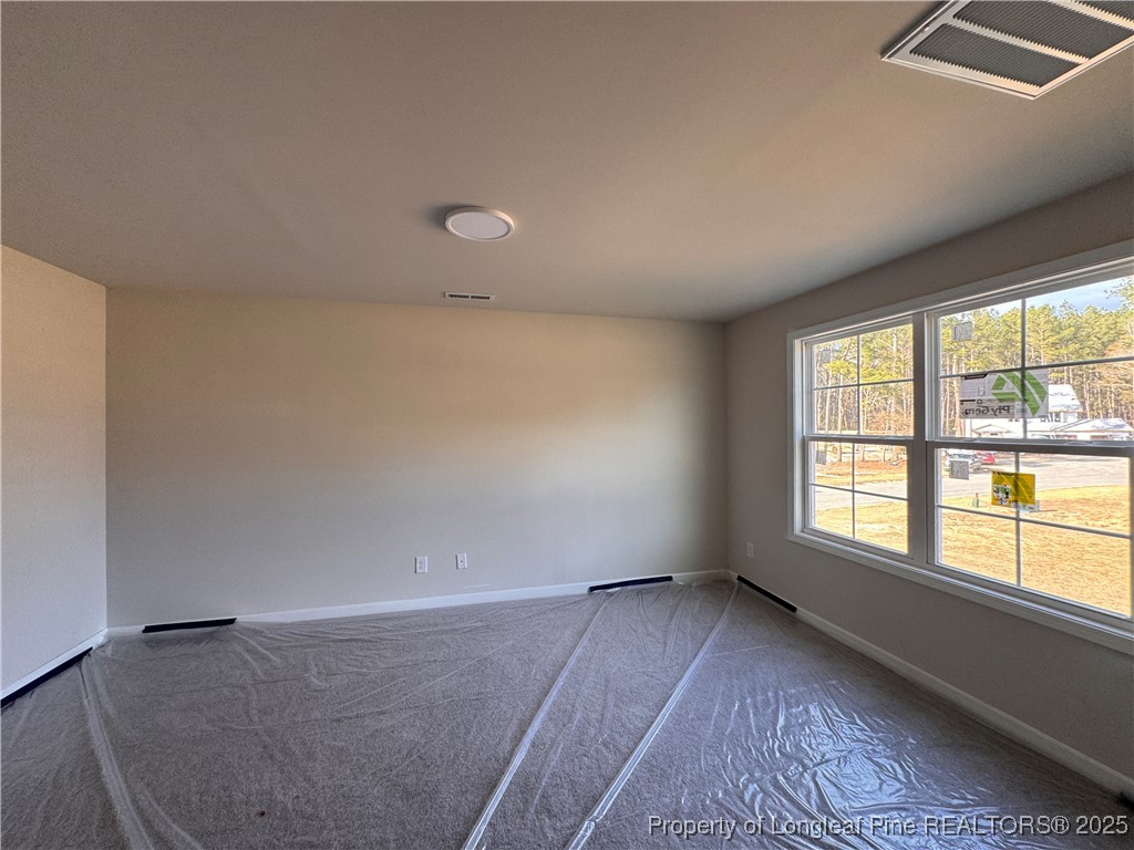 302 Elijah Way Vass, NC 28394 - Photo 18 of 28 an empty room with windows