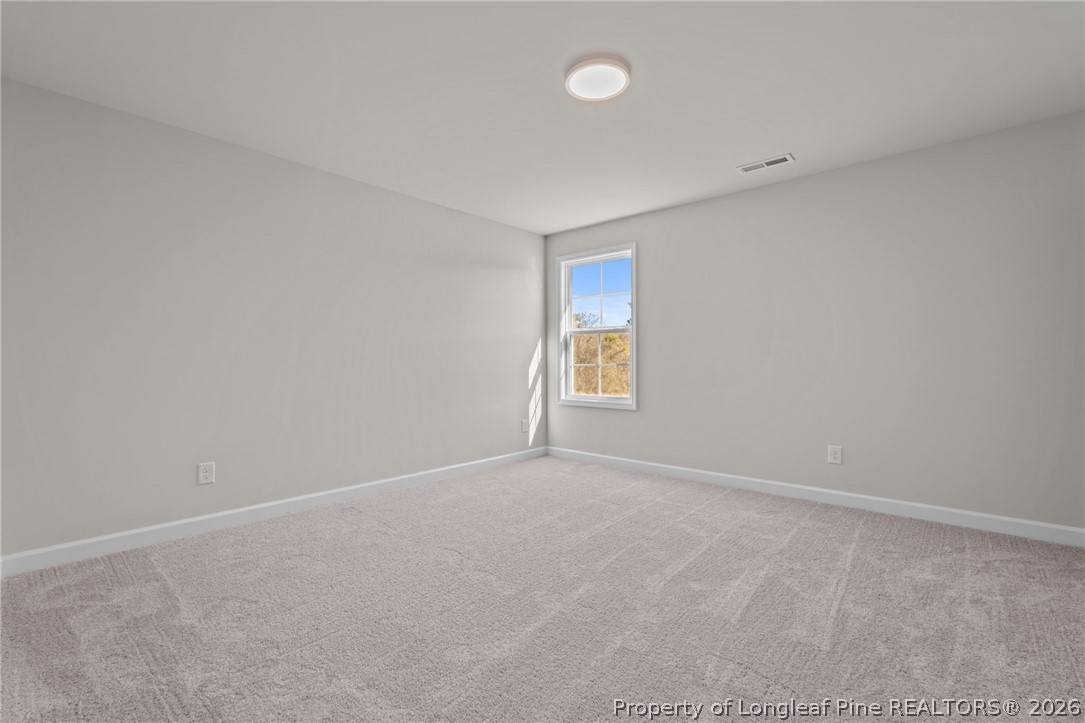 302 Elijah Way Vass, NC 28394 - Photo 18 of 44 an empty room with windows