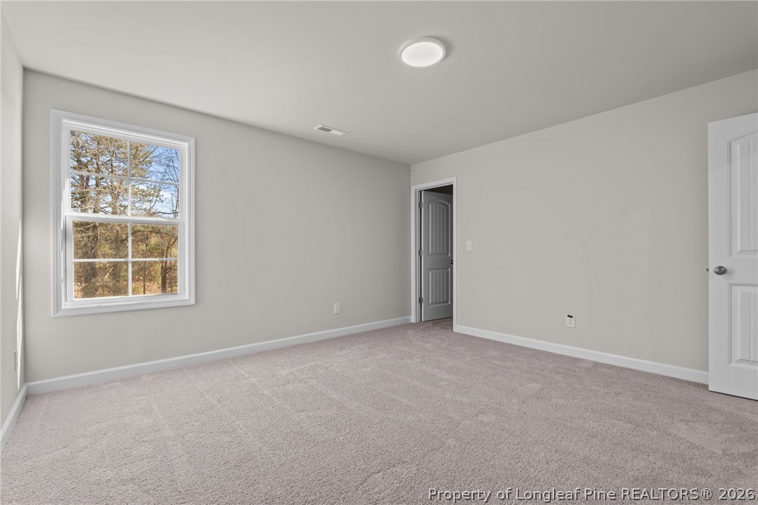 302 Elijah Way Vass, NC 28394 - Photo 19 of 44 an empty room with windows