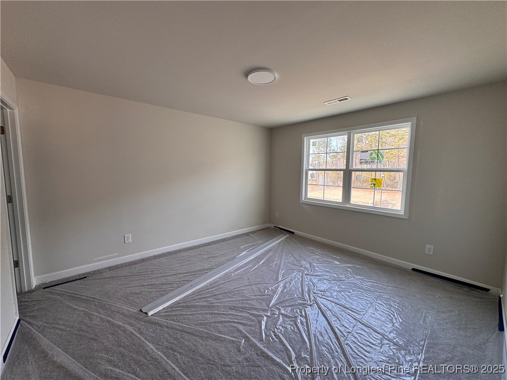 302 Elijah Way Vass, NC 28394 - Photo 19 of 28 an empty room with windows