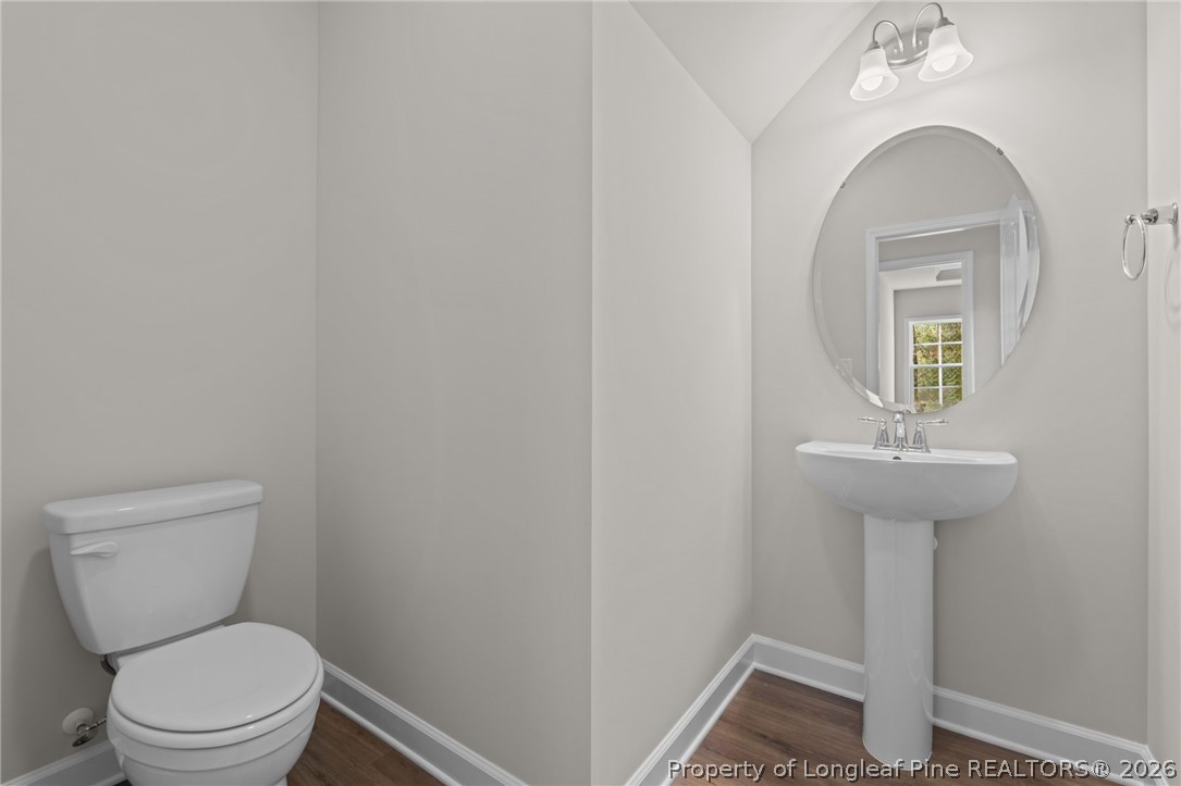 302 Elijah Way Vass, NC 28394 - Photo 20 of 44 a bathroom with a toilet sink and mirror