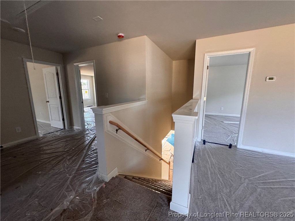 302 Elijah Way Vass, NC 28394 - Photo 23 of 28 a view of a livingroom with furniture and staircase