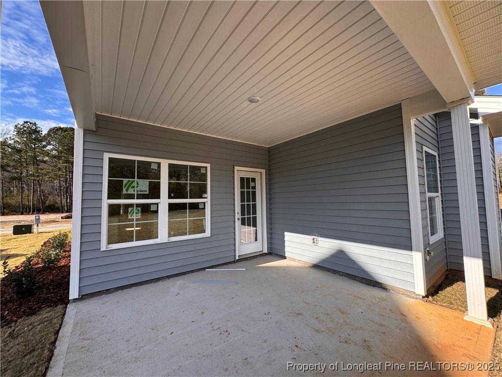 302 Elijah Way Vass, NC 28394 - Photo 25 of 28 a view of a house with a backyard and windows