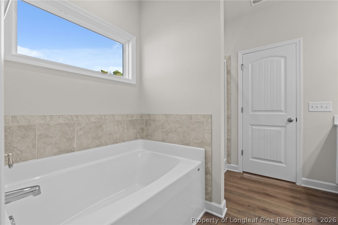 302 Elijah Way Vass, NC 28394 - Photo 25 of 44 a bathroom with bathtub
