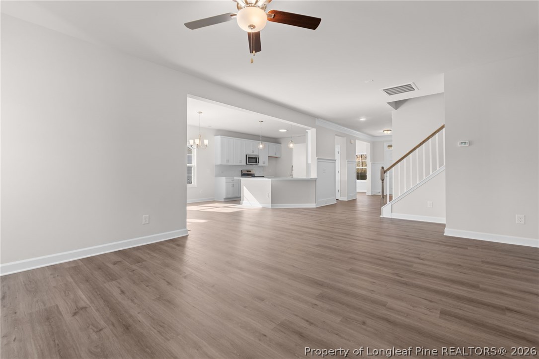 302 Elijah Way Vass, NC 28394 - Photo 30 of 44 wooden floor in an empty room with a window