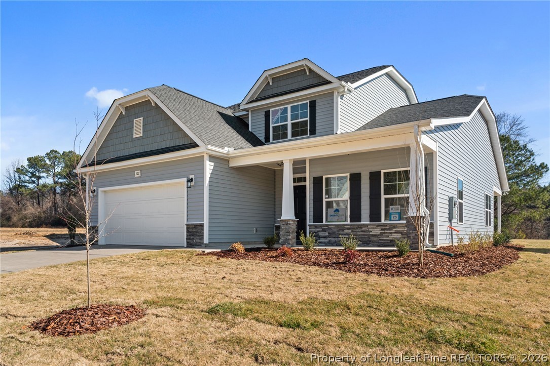 302 Elijah Way Vass, NC 28394 - Photo 3 of 44 a front view of a house with a yard
