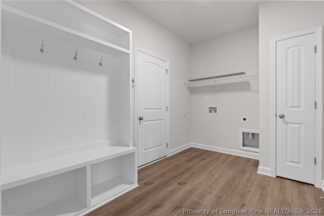 302 Elijah Way Vass, NC 28394 - Photo 36 of 44 a view of an empty room with wooden floor