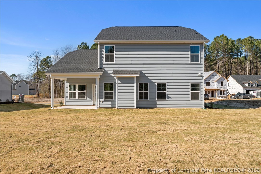 302 Elijah Way Vass, NC 28394 - Photo 42 of 44 a front view of a house with a yard