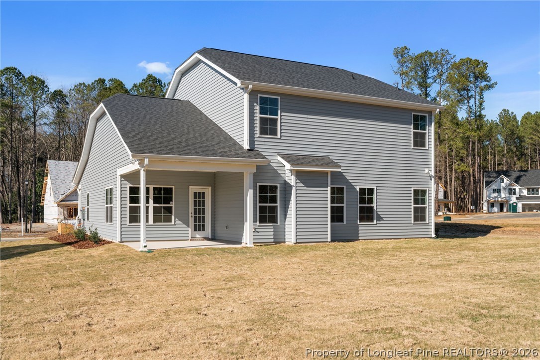 302 Elijah Way Vass, NC 28394 - Photo 43 of 44 a front view of a house with a yard