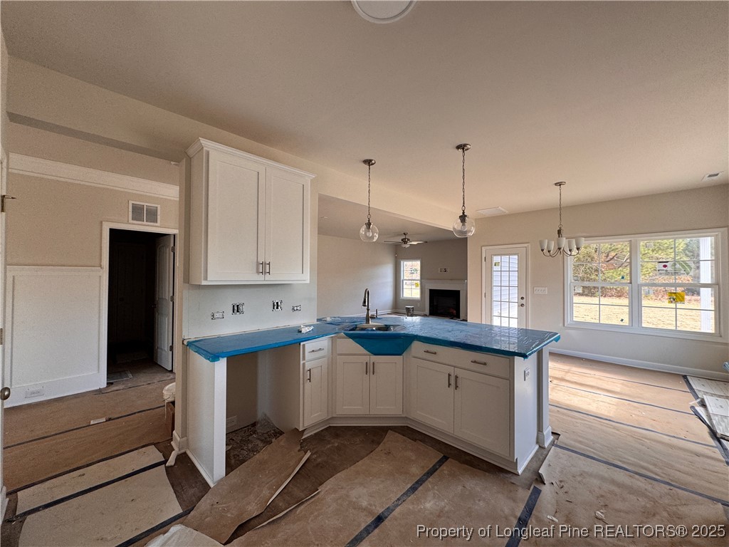 302 Elijah Way Vass, NC 28394 - Photo 6 of 28 a kitchen with stainless steel appliances granite countertop a sink and a refrigerator