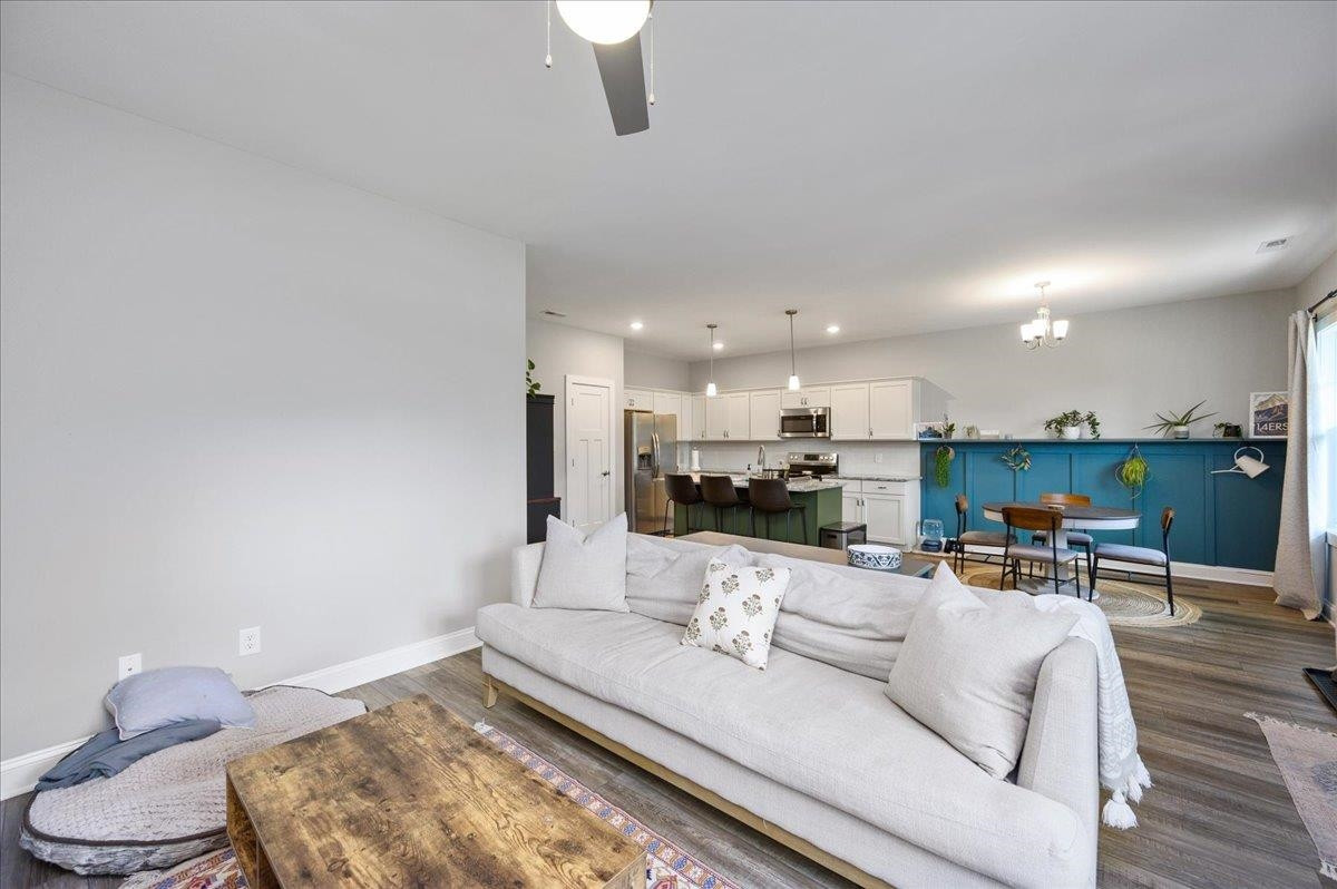 212 North Allen Road Wake Forest, NC 27587 - Photo 12 of 28 a living room with furniture kitchen and a table
