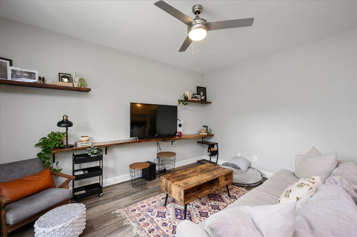 212 North Allen Road Wake Forest, NC 27587 - Photo 13 of 28 a bedroom with furniture and a flat screen tv
