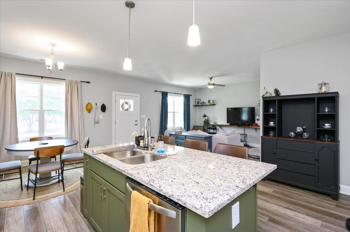 212 North Allen Road Wake Forest, NC 27587 - Photo 18 of 28 a large kitchen with kitchen island a sink table and chairs