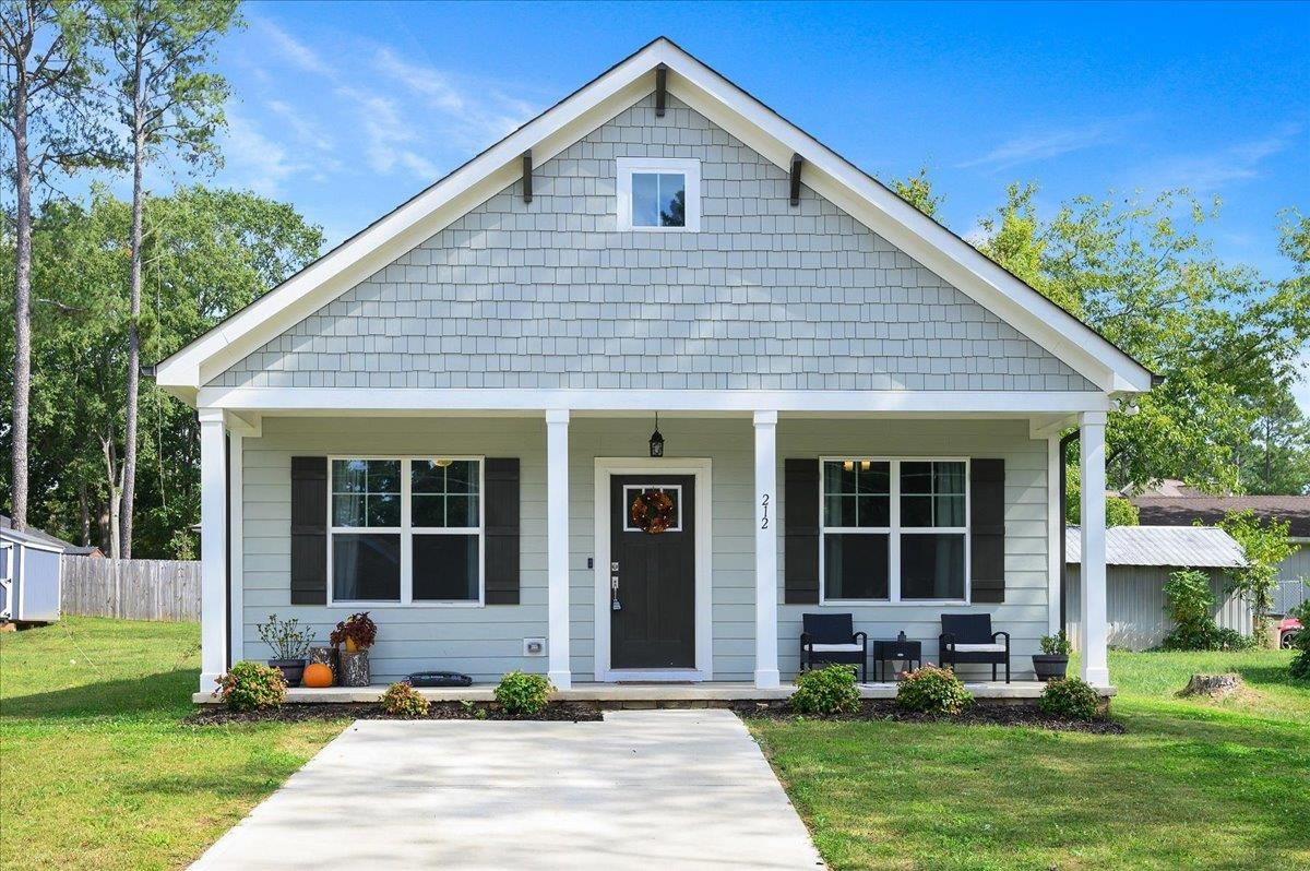 212 North Allen Road Wake Forest, NC 27587 - Photo 2 of 28 a front view of a house with a yard