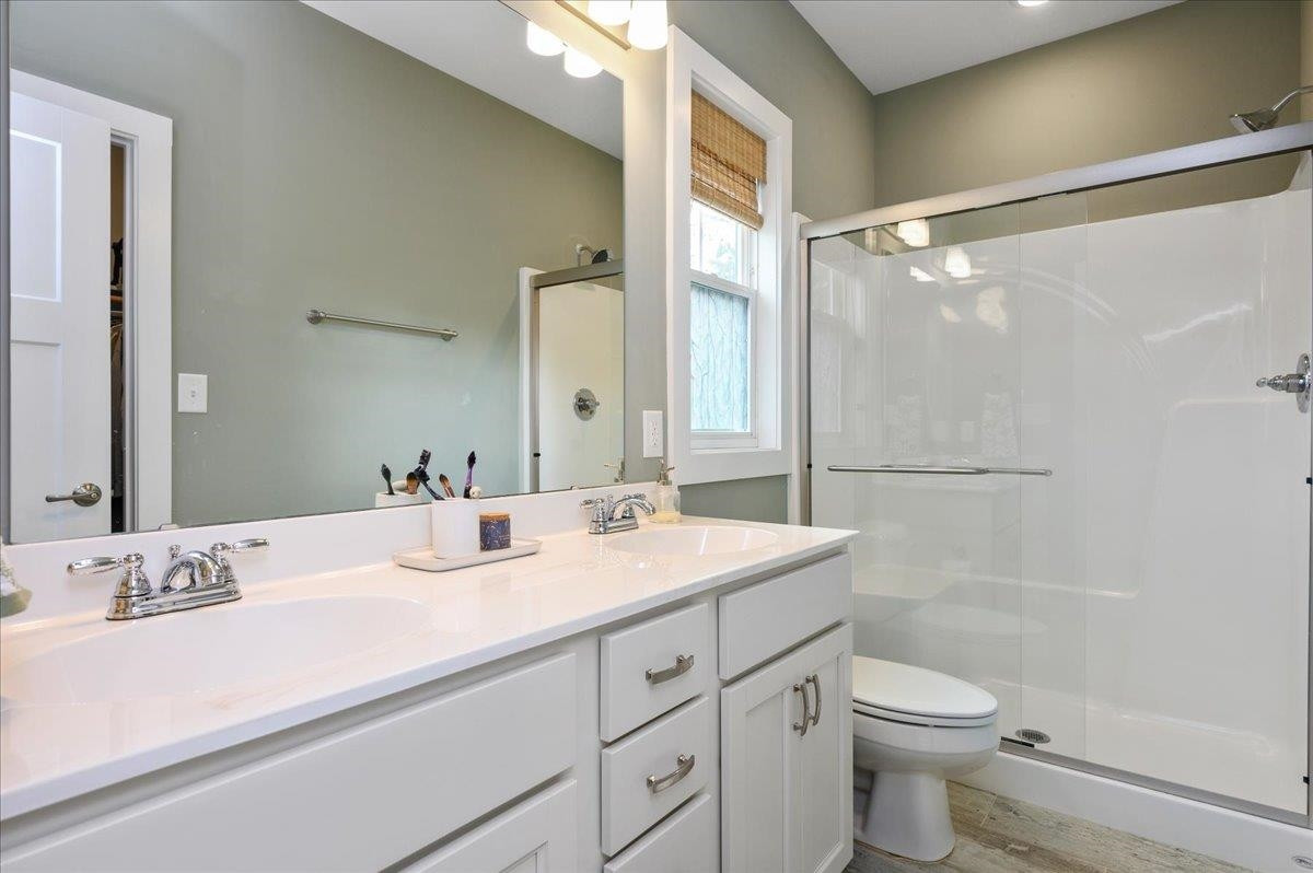 212 North Allen Road Wake Forest, NC 27587 - Photo 25 of 28 a bathroom with a sink a toilet and shower