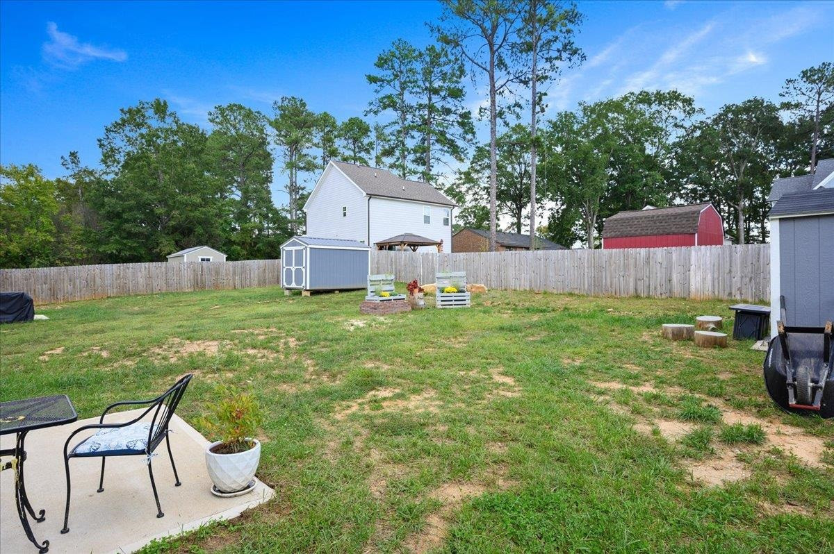212 North Allen Road Wake Forest, NC 27587 - Photo 7 of 28 a backyard of a house with table and chairs