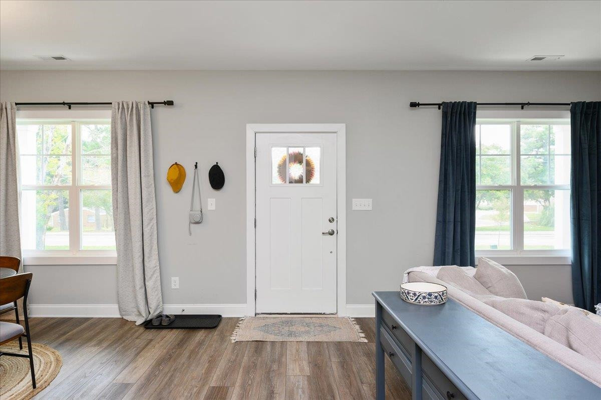 212 North Allen Road Wake Forest, NC 27587 - Photo 9 of 28 a view of a livingroom with a window and wooden floor