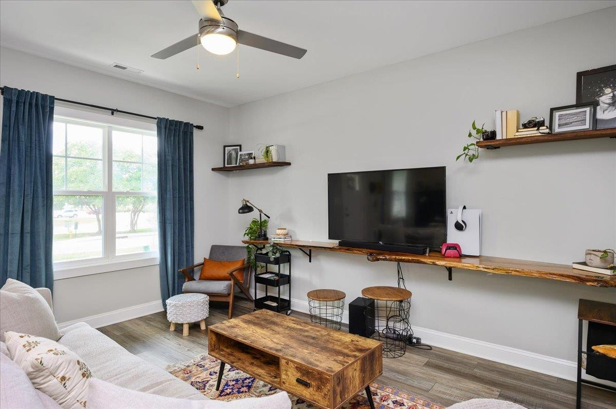 212 North Allen Road Wake Forest, NC 27587 - Photo 10 of 28 a living room with furniture and a flat screen tv