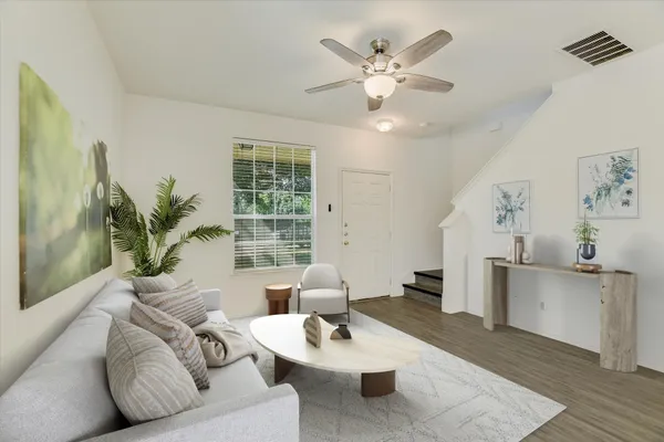 a living room with furniture and a large window
