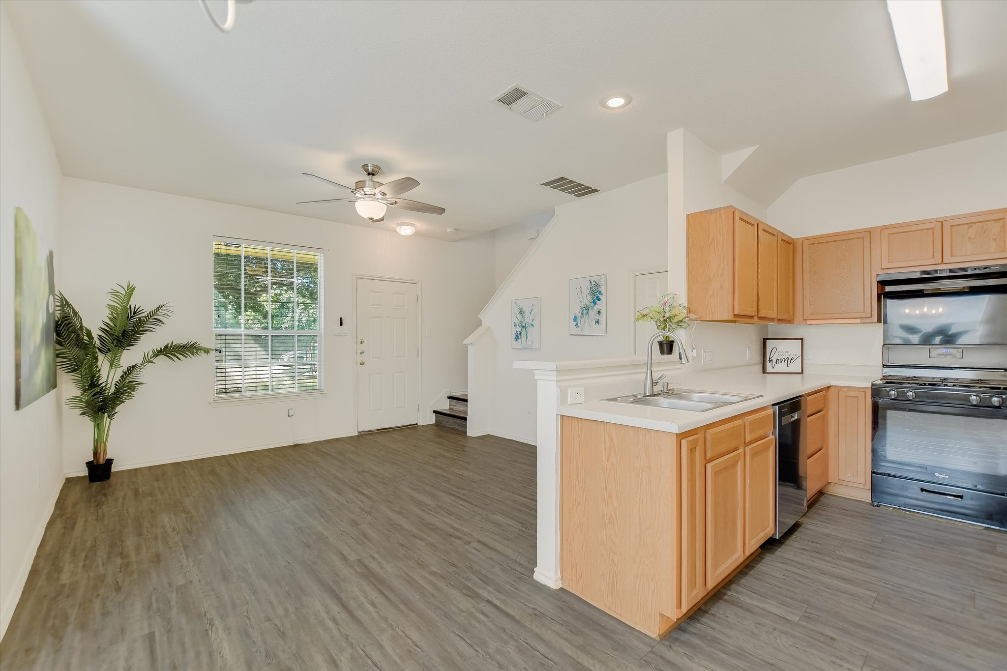 809 Sebastian Bend, Unit B Pflugerville, TX 78660 - Photo 9 of 34 a kitchen with a sink and cabinets