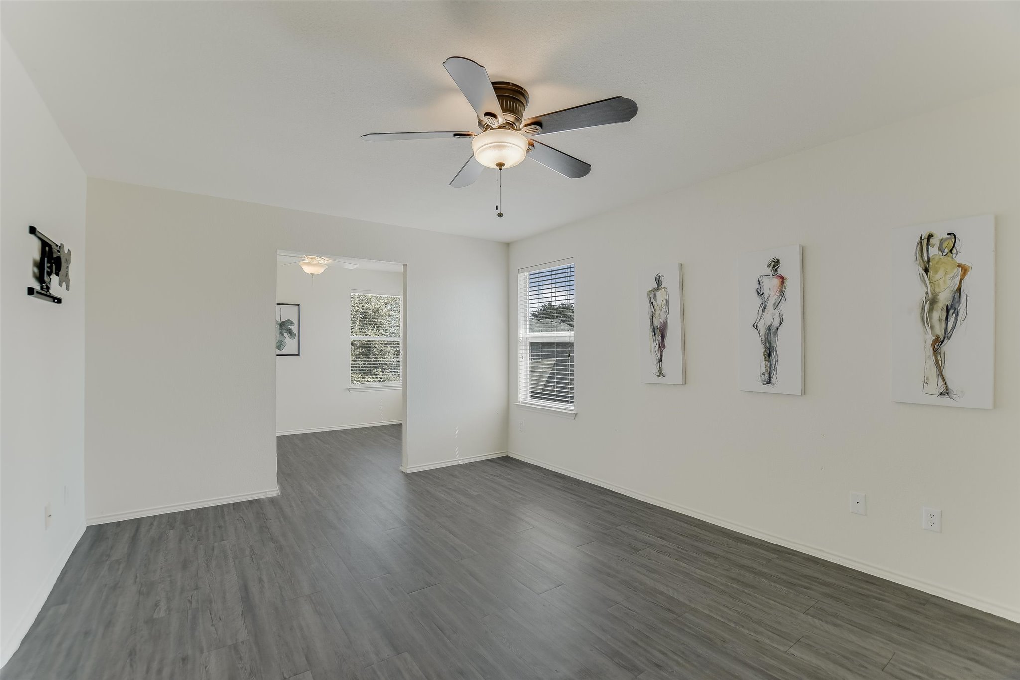 809 Sebastian Bend, Unit B Pflugerville, TX 78660 - Photo 15 of 34 wooden floor in an empty room with a window