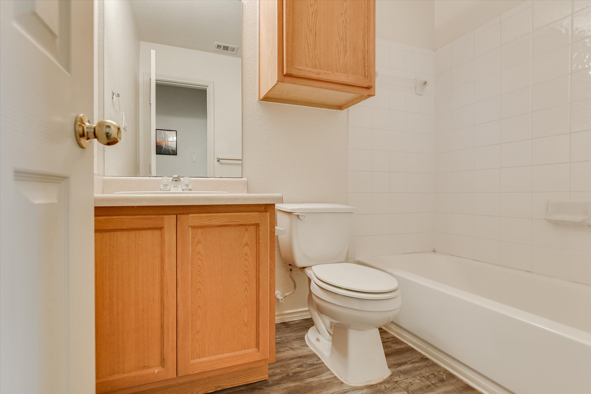 809 Sebastian Bend, Unit B Pflugerville, TX 78660 - Photo 20 of 34 a bathroom with a toilet and a sink