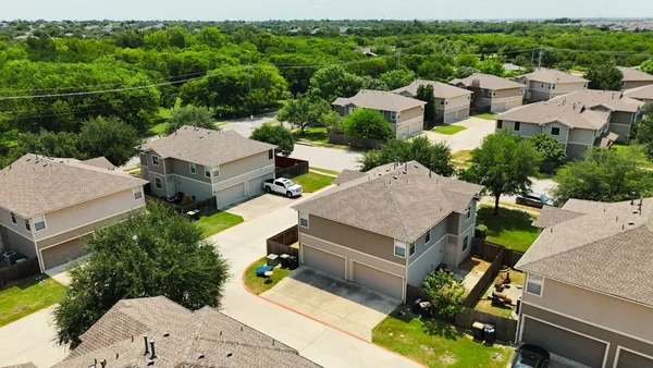 an aerial view of a house with swimming pool