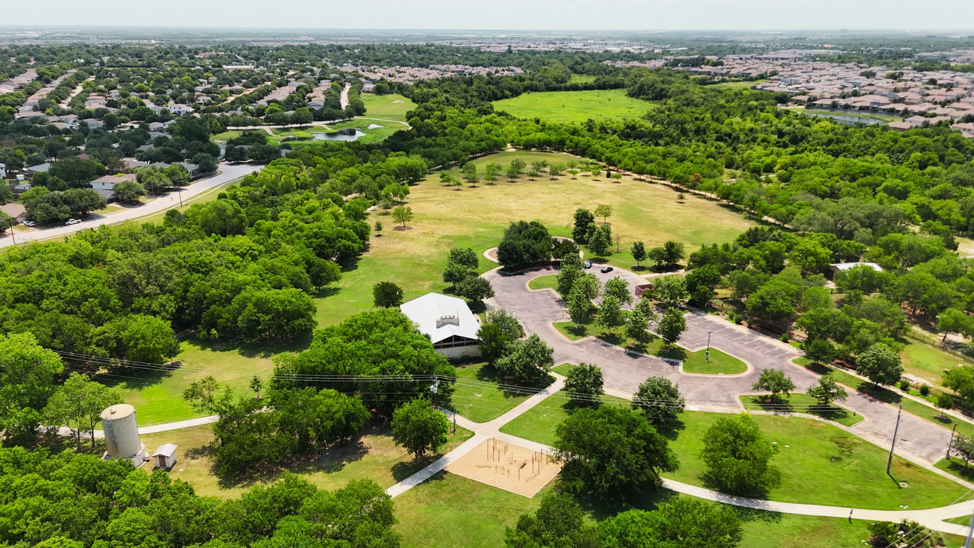 809 Sebastian Bend, Unit B Pflugerville, TX 78660 - Photo 31 of 34 an aerial view of lake residential houses with outdoor space