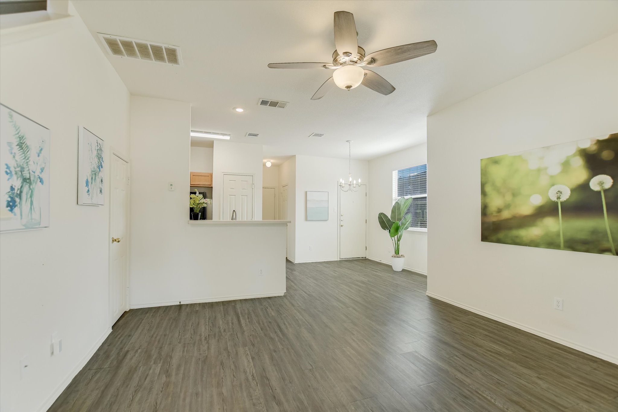 809 Sebastian Bend, Unit B Pflugerville, TX 78660 - Photo 8 of 34 a view of an empty room with wooden floor