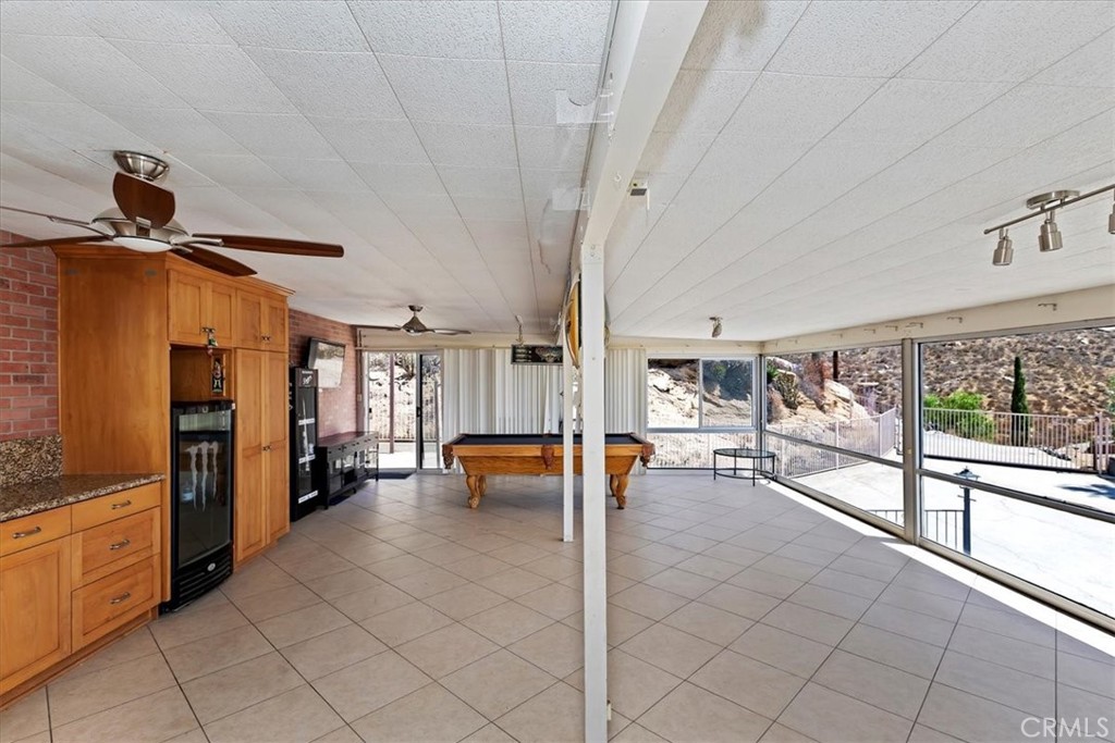 20620 Hill Top Drive Riverside, CA 92507 - Photo 24 of 46 30x20 bonus room with four entry points (front entrance, kitchen, laundry, attached carport)